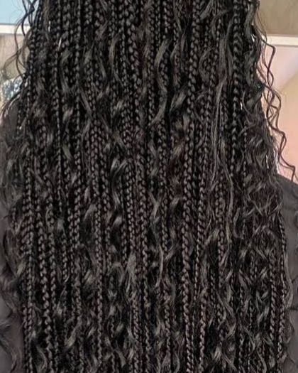 Long black boho braids with loose curly pieces