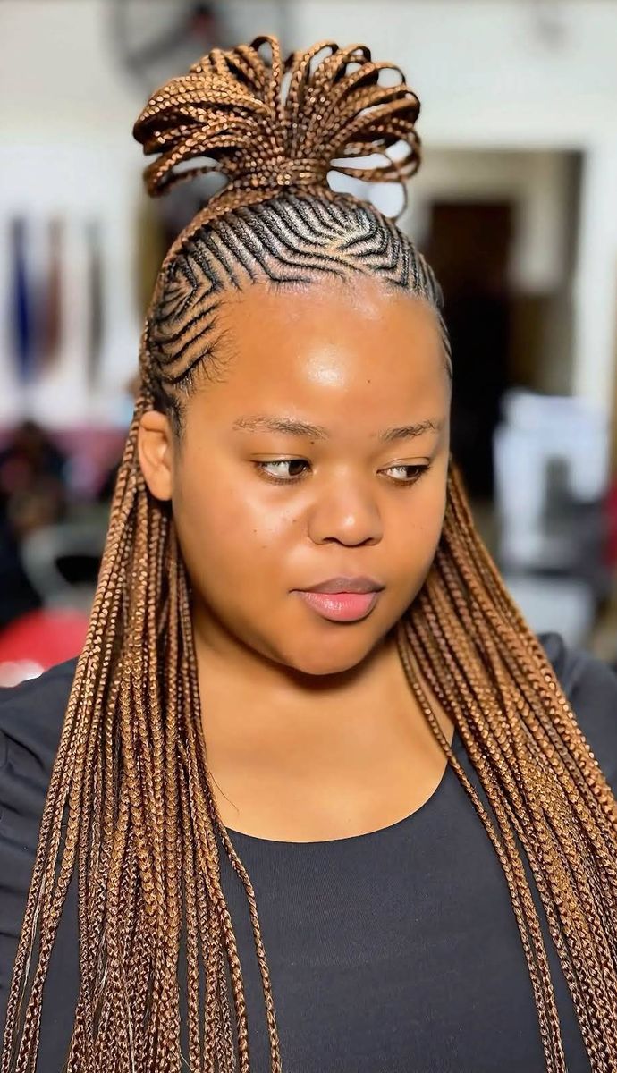 Honey-brown Fulani braids with a looped top knot